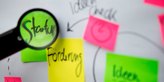 Colorful sticky notes on a white board